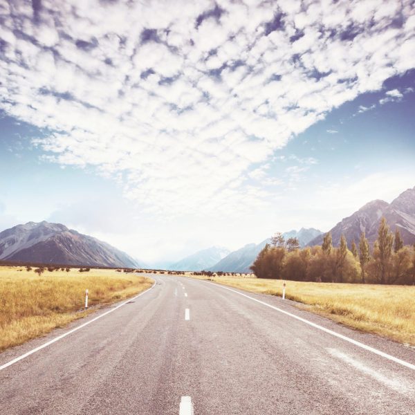 Scenic,Road,Among,Green,Hills,In,New,Zealand.