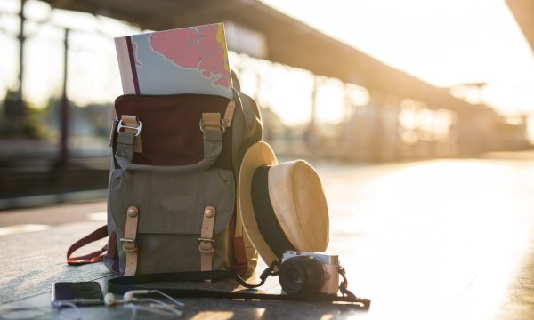 Map,In,Backpack,,mobile,Phone,With,Earphone,And,Hat,At